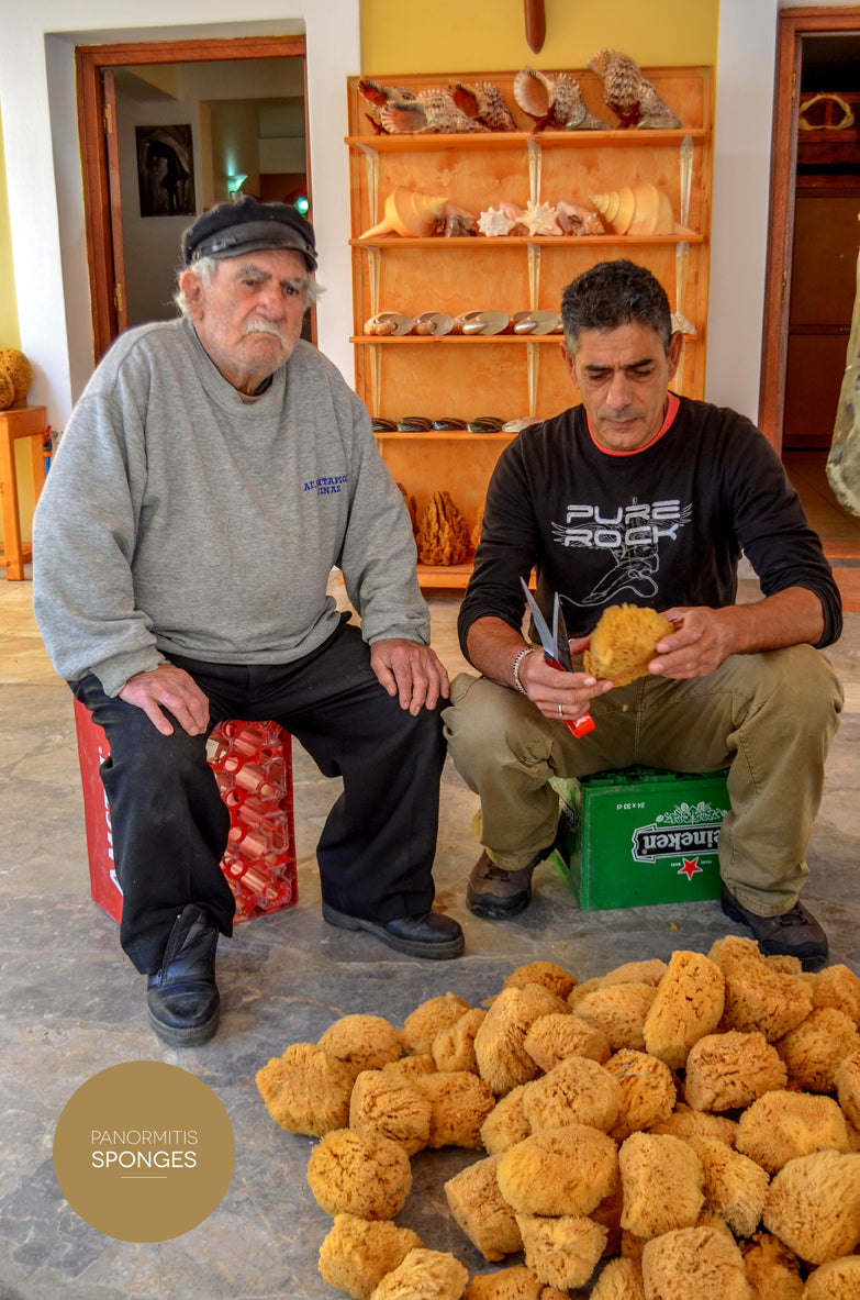 Pantelis's father trimming a sponge in the shop he opened
